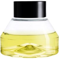 Clear glass bottle with black cap containing yellow citrus-scented diffuser refill liquid by Diptyque.