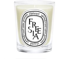 Diptyque Freesia Candle 190g in clear glass with black and white label, featuring elegant typography.