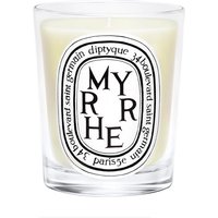 Diptyque Myrrhe candle in clear glass holder with black and white label, featuring bold text and decorative border.