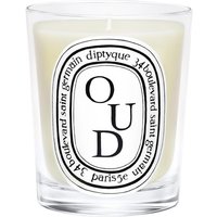 Diptyque Oud Candle in clear glass jar with black and white oval label featuring bold "OUD" text.