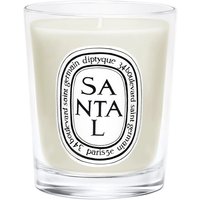 Diptyque Santal candle in clear glass jar with black and white label, featuring woody fragrance text.