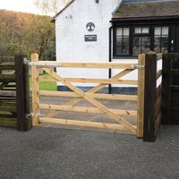 Wooden Croft Prestige gate, 6’x4’, natural finish, diagonal cross-bracing, metal hinges, set between dark posts.
