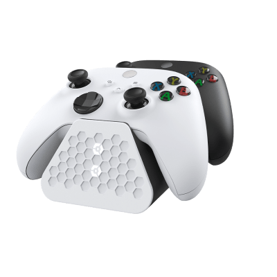Black Gioteck Xbox Duo Charging Stand with a textured hexagonal base, holding two Xbox controllers—one white and one black—designed for efficient charging and storage.