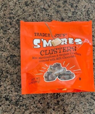 Bright orange packaging featuring "S'mores Clusters" in bold white letters, with images of marshmallows and graham crackers, containing mini chocolate-covered treats.