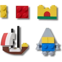 Set of five colorful Jibbitz charms for Crocs, featuring block designs like a castle, ship, and geometric shapes.