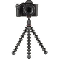 Black Joby GorillaPod 1K tripod with flexible legs, supporting a digital camera, compact and versatile design.