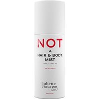 White cylindrical bottle of Juliette has a Gun Not a Hair and Body Mist with bold red and black text.