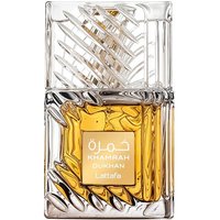 Clear glass bottle with intricate geometric design, amber liquid, and gold label reading "Khamrah Dukhan Lattafa."