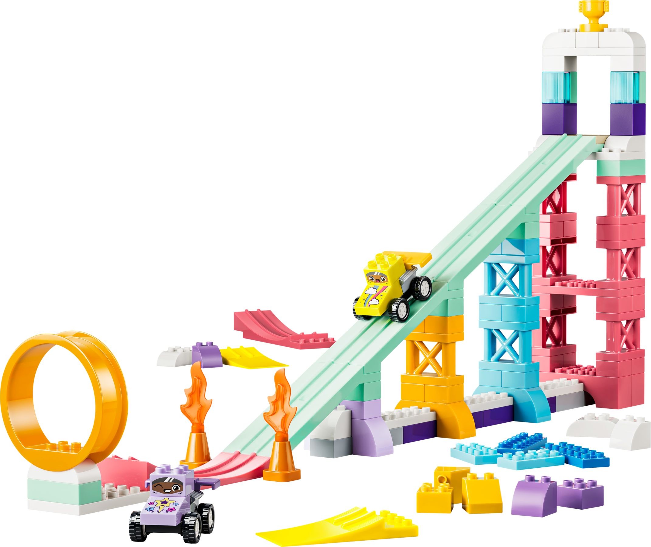 Colorful LEGO set featuring a 3-in-1 ramp structure with pink, blue, and yellow bricks, two toy vehicles, a loop, and accessories like ramps and flames.
