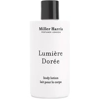 White Miller Harris Lumiere Doree body lotion bottle with black cap, 250 ml, featuring elegant black text.