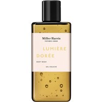 Miller Harris Lumiere Doree Body Wash 250 ml in a clear amber bottle with black cap and minimalist label design.