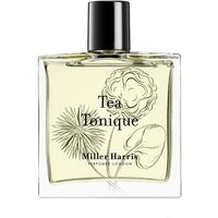Clear glass bottle of Miller Harris Tea Tonique perfume with black cap and floral illustration on label.
