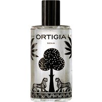 Clear glass bottle with black cap, featuring black palm tree and leopard design, labeled "Ortigia Zagara Room Essence."