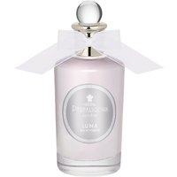 Clear glass bottle of Luna Eau de Toilette with silver cap and white bow, featuring a floral fragrance label.