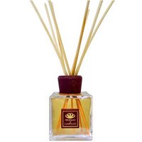 Square glass diffuser with brown cap, filled with yellow liquid and reed sticks, labeled "Profumo di Campiglio."