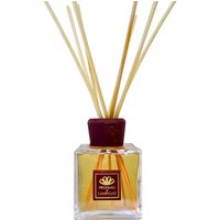 Square glass bottle with brown label, filled with amber liquid, topped with wooden reeds, Profumo di Campiglio diffuser.