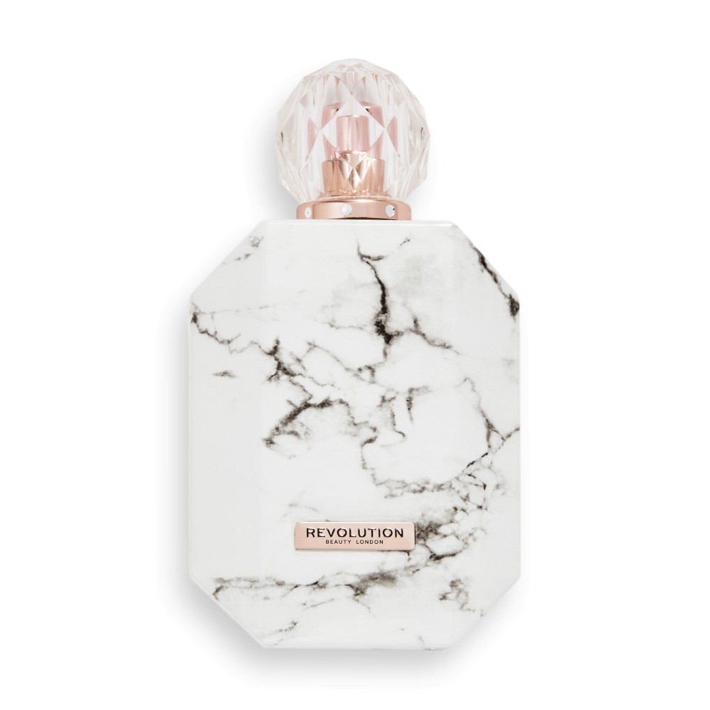 Timeless Eau De Toilette by Revolution in a marble-patterned white bottle with a pink crystal-like cap and a rose gold accent label.