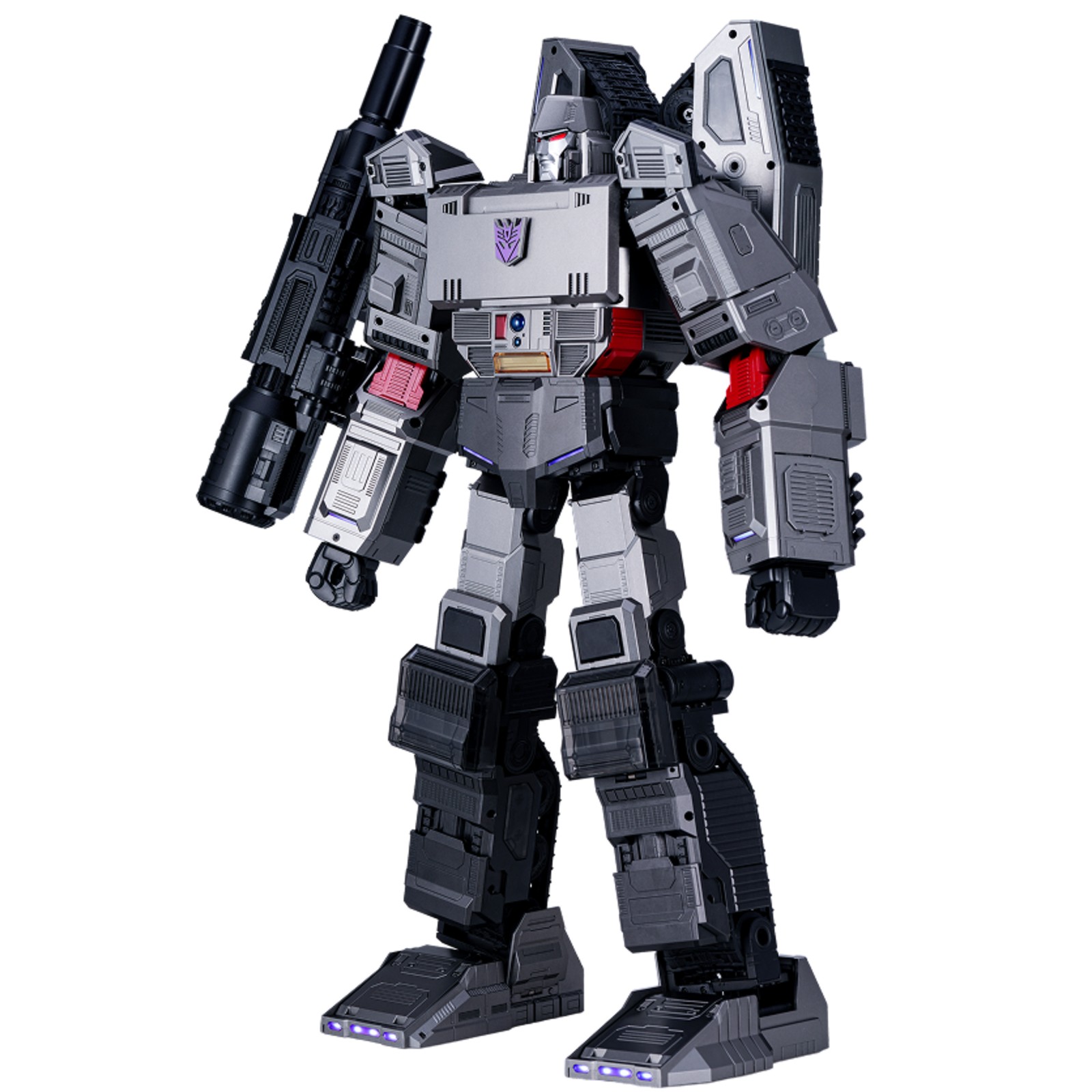 Transformers Megatron robot in metallic grey with black accents, featuring a detailed design, movable joints, and a detachable cannon on its arm.