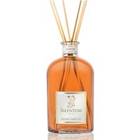 Clear glass bottle of Salentum Agrumi diffuser with orange liquid and reed sticks.