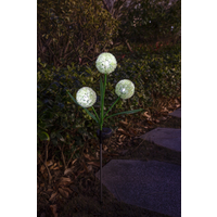 Solar Allium Bloom garden light with three glowing white spherical bulbs on green stems, set in a nighttime garden.