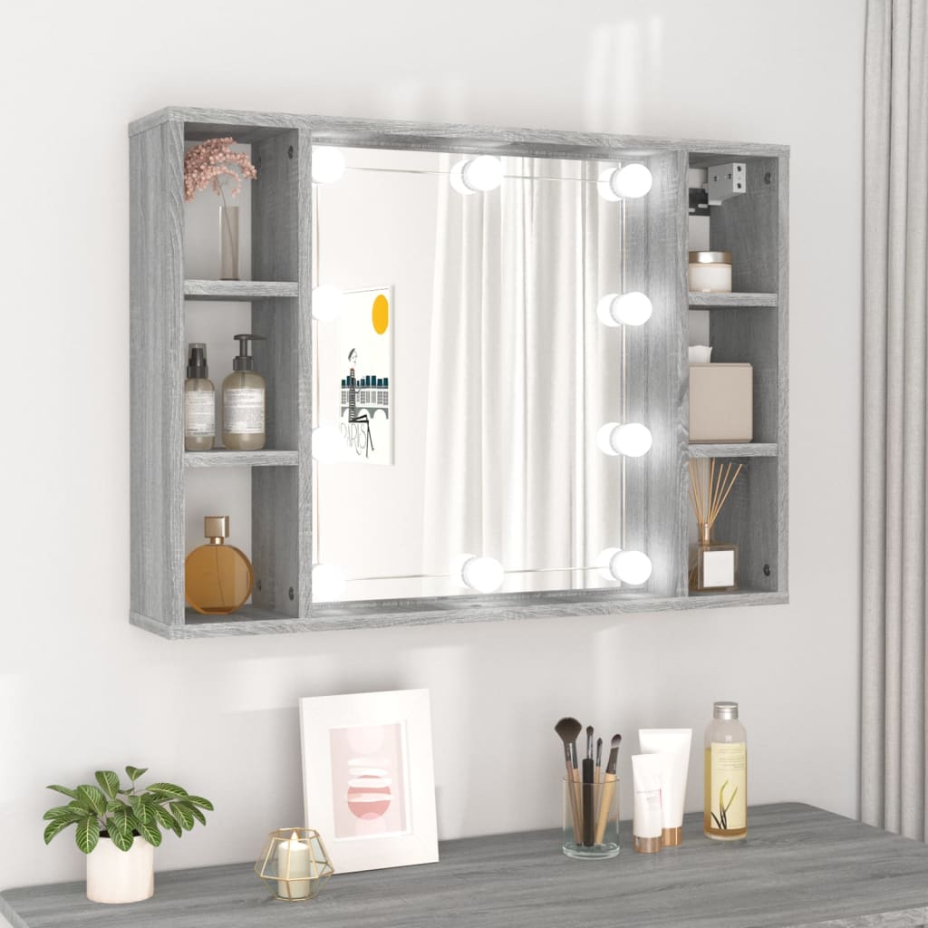 Grey Sonoma mirror cabinet featuring LED lights, two side shelves for storage, and a central mirror, ideal for vanity setups, measuring 76x15x55 cm.