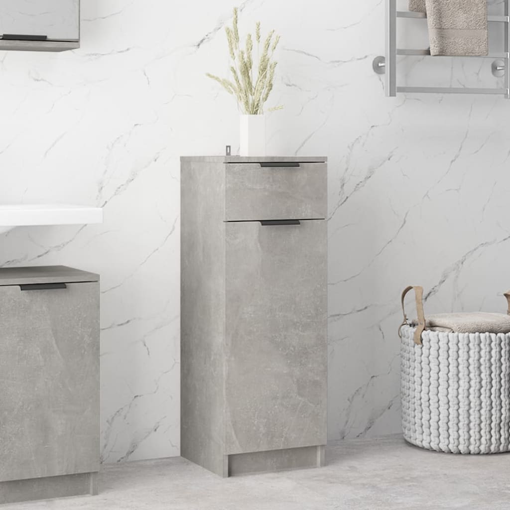 Concrete grey bathroom cabinet made of engineered wood, featuring two drawers with sleek black handles, set against a marble backdrop with decorative elements.