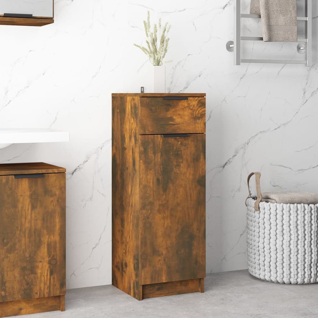 Tall, smoked oak bathroom cabinet made of engineered wood, featuring a sleek design with one drawer and a cabinet door, complemented by a decorative vase on top.