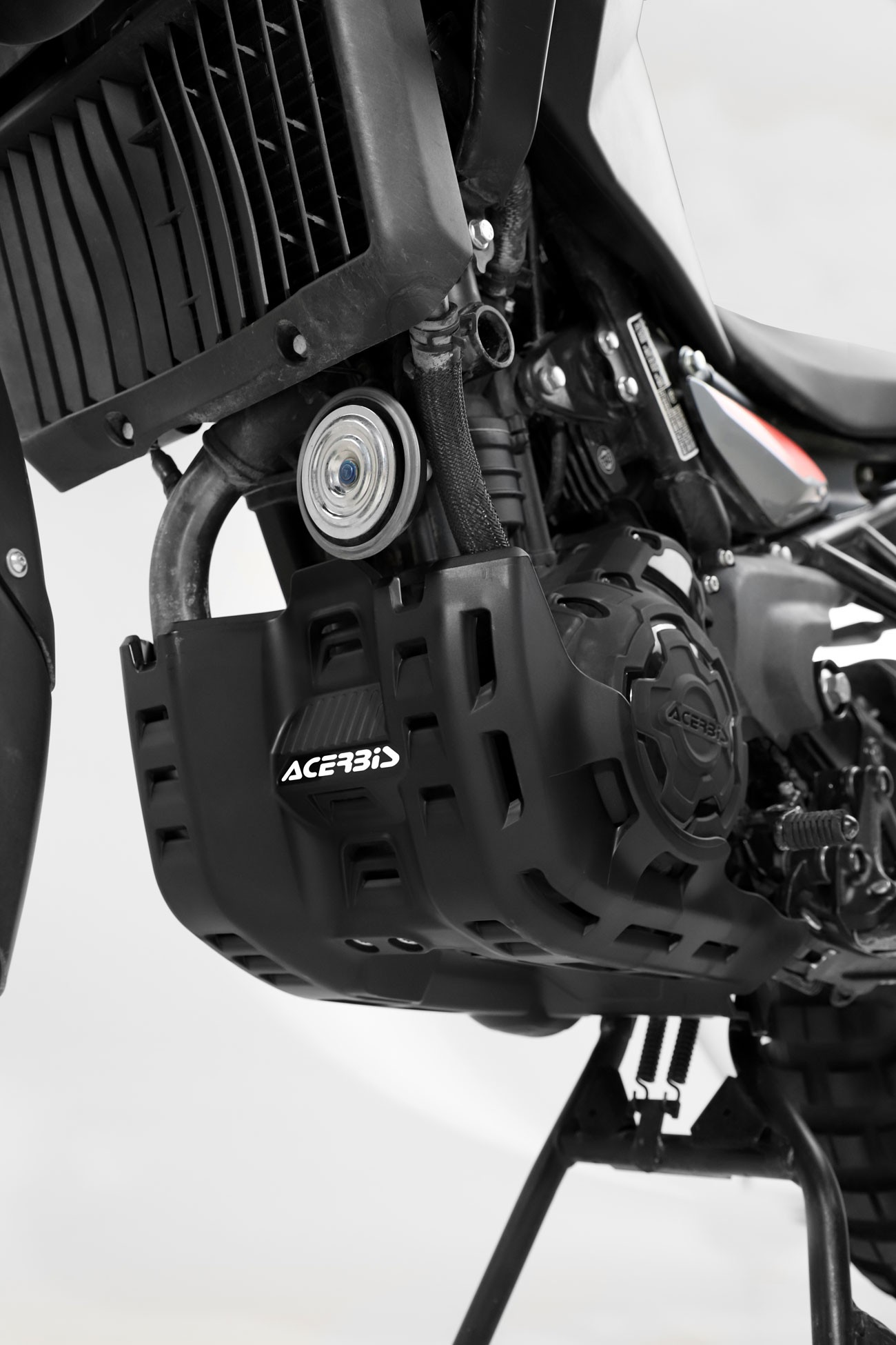 Black skid plate designed for the Acerbis Royal Enfield Himalayan 450, featuring a rugged, protective structure with ventilation openings and the Acerbis logo prominently displayed.
