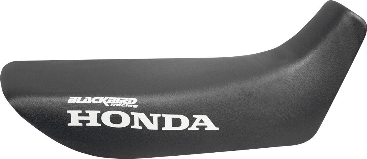 Blackbird seat cover in black synthetic material, designed for Honda NX 500 (1988-2000), featuring white "HONDA" logo and "BLACKBIRD Racing" branding.