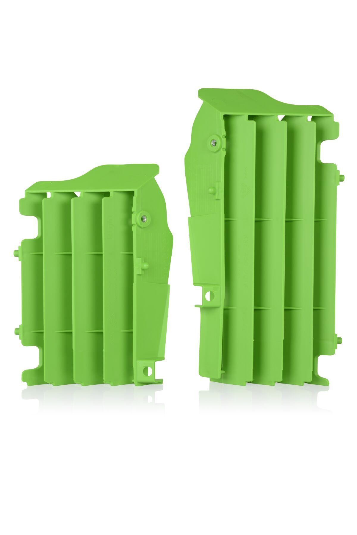 Bright green plastic radiator louvers with a ribbed design, featuring mounting points for easy installation, designed for enhanced airflow and cooling in motocross applications.