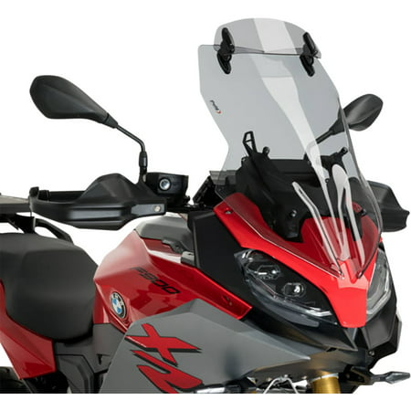 Light smoke Puig Touring Screen with extender, designed for BMW F900 XR (2020-2025), featuring a sleek design and durable material, mounted above the motorcycle's handlebars.