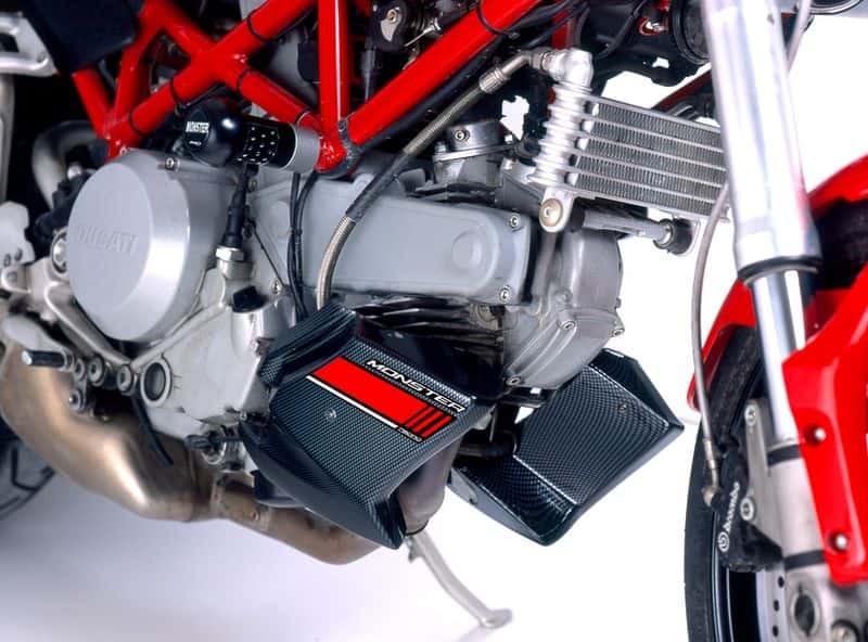Matt black Puig engine spoiler designed for Ducati Monster 937 (2021-2025), featuring a sleek, aerodynamic shape and distinctive red accents.