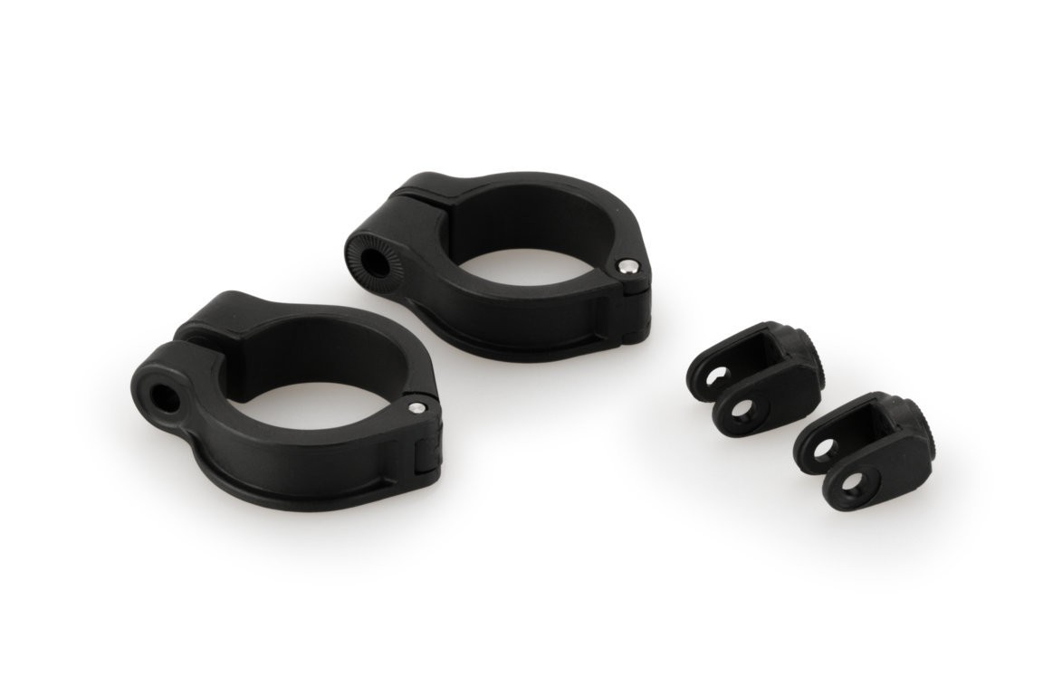 Black Puig R19 frame slider adapters designed for auxiliary lights, featuring two circular clamps and two smaller brackets, made from durable material for KTM 125 Duke 2017-2025 models.