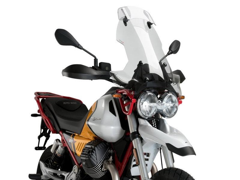 Clear Puig Touring Screen with Extender for Moto Guzzi V85, featuring a sleek design, durable material, and evocative graphics, enhancing wind protection and style for 2021-2023 models.