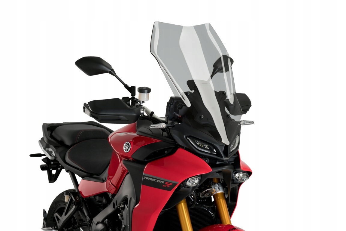 Puig Touring Screen for Yamaha Tracer 9 (2021-2024) in light smoke, featuring a sleek, aerodynamic design, mounted on a red motorcycle with black accents.