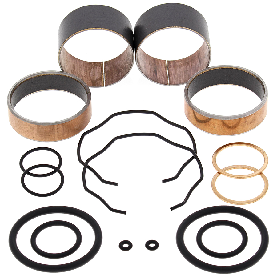 All Balls Fork Bushing Kit featuring four cylindrical bushings with a bronze and black finish, accompanied by various rubber seals and O-rings for Kawasaki KX models from 1992 to 2024.