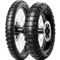 Black Metzeler Karoo 4 motorcycle tire (90/90-21 TL 54T M+S) with a rugged tread pattern, designed for front wheel use, showcasing durable rubber and metal spokes.