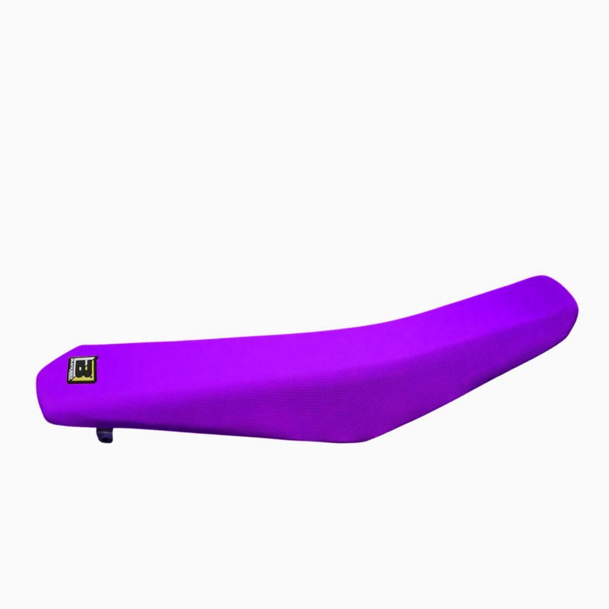 High grip universal seat cover in vibrant purple, featuring a sleek design with textured material and a Blackbird logo tag for added style and functionality.