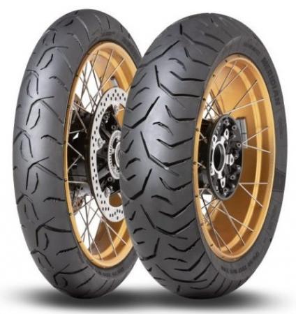 Dunlop Trailmax Meridian rear motorcycle tire, size 130/80 R17, features a black rubber tread with a unique pattern and a gold alloy wheel rim, designed for off-road and adventure riding.
