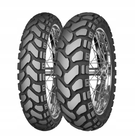 Mitas Enduro Trail + front motorcycle tire featuring a 90/90-21 size, dual branding, M+S marking, and a rugged tread pattern for enhanced traction on various terrains.