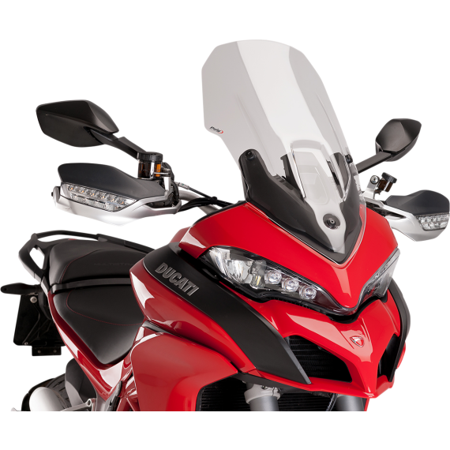 Clear Puig Touring Screen designed for Ducati Multistrada 1200 (2015-2017), featuring a sleek aerodynamic shape, mounted above a striking red motorcycle with black accents.