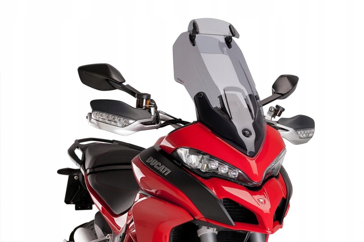 Puig Touring Screen with Extender for Ducati Multistrada 1200 (2015-2017) in light smoke color, featuring a sleek design and enhanced wind protection, mounted on a red motorcycle.