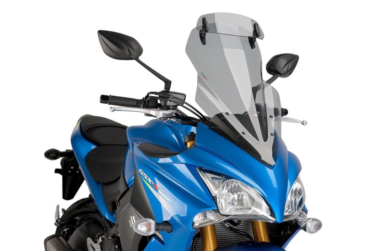 Light smoke Puig Touring Screen with extender, designed for Suzuki GSX S 1000 F (2015-2020), featuring a sleek, aerodynamic shape and durable material, mounted above the motorcycle's handlebars.