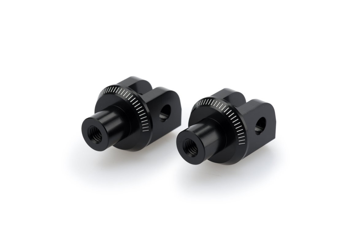 Black aluminum Puig footpeg adaptors designed for Kawasaki Ninja 400 (2018-2024), featuring a sleek finish and precise threading for secure attachment.