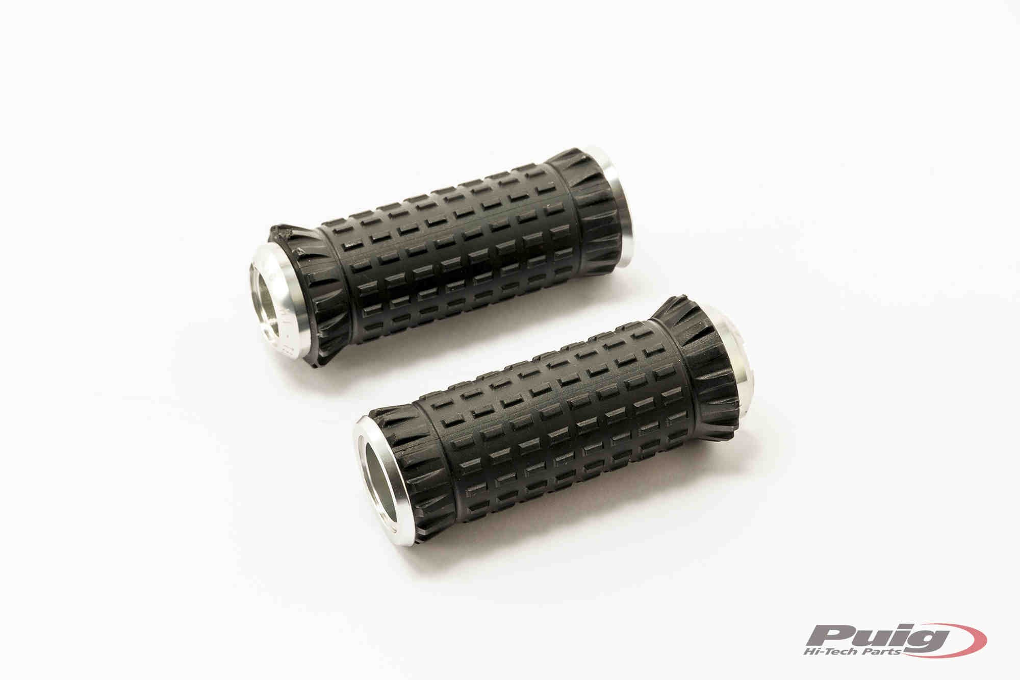 Silver footpegs with a textured black rubber grip, designed for KTM 1050 Adventure models from 2015-2016, featuring a sturdy, ergonomic design for enhanced rider comfort.