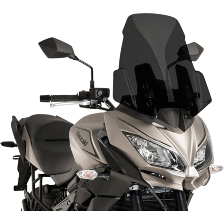 Puig Touring Screen in dark smoke for Kawasaki Versys 650 (2015-2021) features a sleek, aerodynamic design, enhancing wind protection and style on the motorcycle.