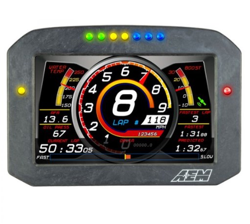 Carbon-finished digital dash with a large central speedometer, multiple gauges for oil temp, boost, and lap timing, illuminated indicator lights at the top, and a sleek flat panel design.