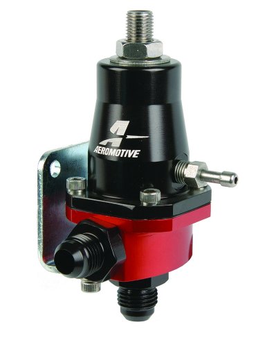 Compact EFI adjustable fuel pressure regulator in black and red, featuring a metal body, mounting bracket, and multiple connection ports for fuel lines.