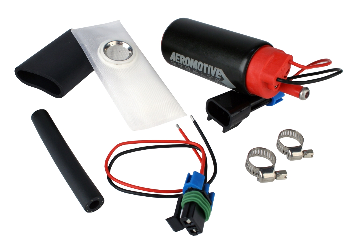 Black and red fuel pump with a center inlet, sock filter, rubber hoses, and clamps, designed for gas or E85 fuel, capable of 340 liters per hour at 90 PSI maximum.