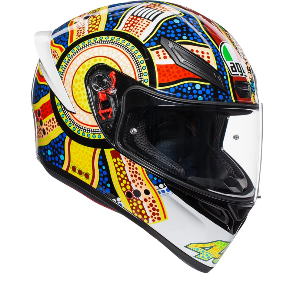 Full face AGV K1 S Dreamtime helmet in white, blue, orange, and yellow, featuring a vibrant indigenous art design, with a clear visor and aerodynamic shape. Size L.